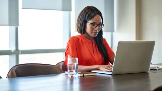 Woman on laptop applying to jobs