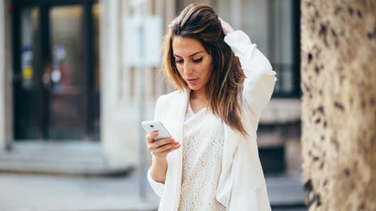 A woman looking at her phone