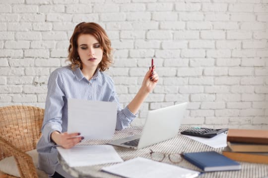 professional woman reading contract
