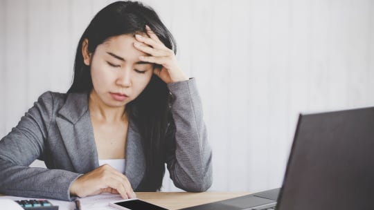 Woman frustrated at desk