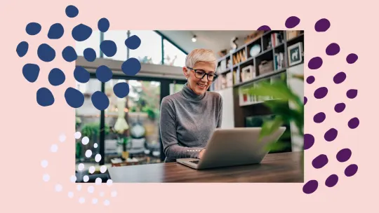 woman working on laptop smiling