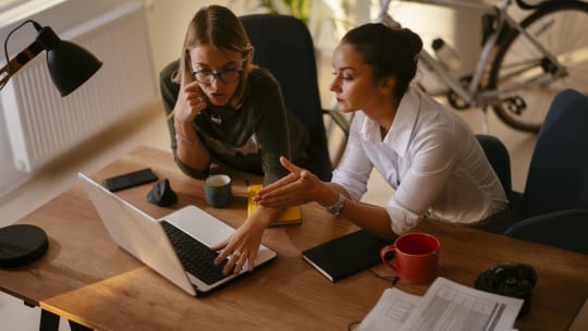 Boss and direct report having conversation