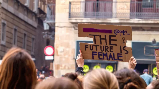 the future is female quote on a cardboard sign