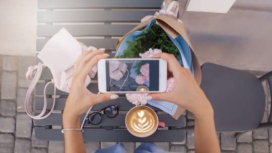 Woman taking picture for Instagram