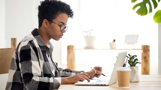 woman taking a test on her laptop