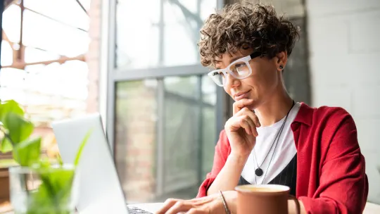 Woman typing on computer