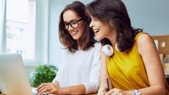 women looking at laptop