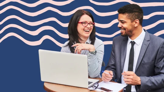 two workers laughing