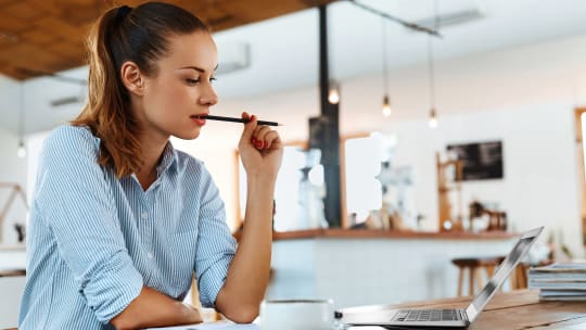 Woman writing cover letter on computer