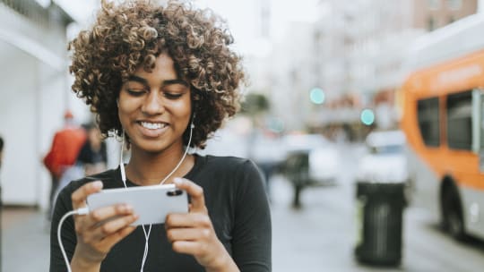 Woman watching video on her phone