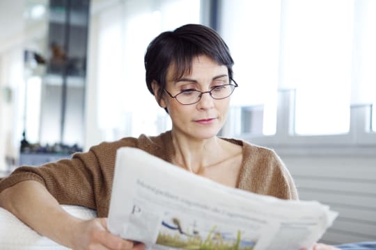 Woman Reading Newspaper