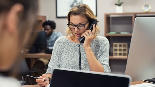 Woman on phone at work