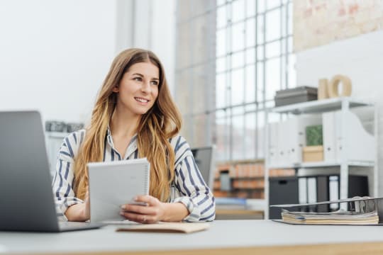 financial analyst at her desk