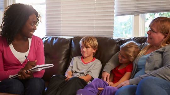 social worker talking to family