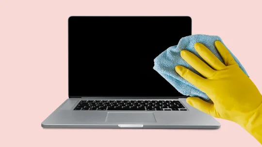 person scrubbing computer screen