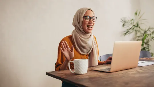 Happy woman on laptop