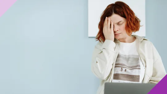 A perplexed woman in front of a laptop to illustrate the importance of learning how to spot job scams
