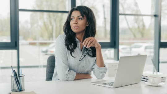 Woman thinking at work