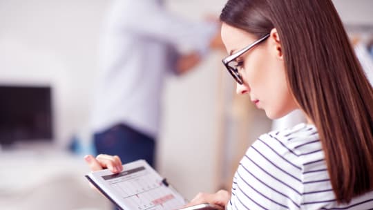 woman marking calendar