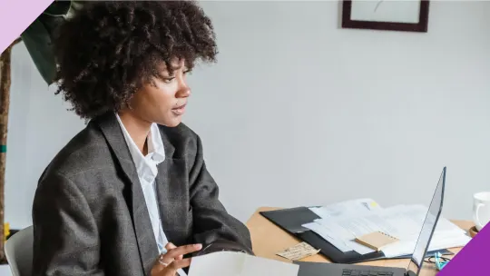 A woman at her work desk illustrating that it's possible to make a lateral move in your career