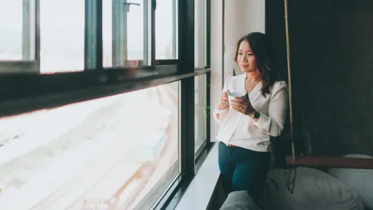 Woman looking out window