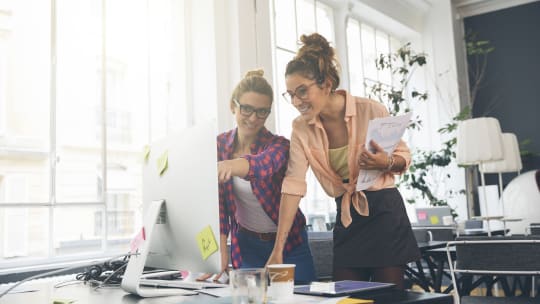 Two women at computer