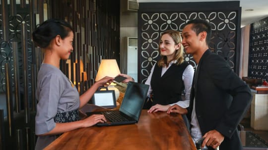 bed and breakfast employee welcoming guests