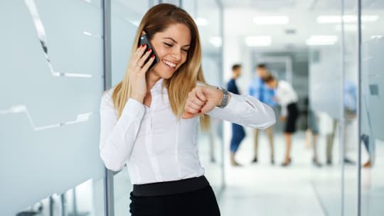 woman on phone checking the time