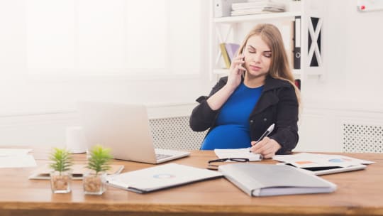 Pregnant woman working