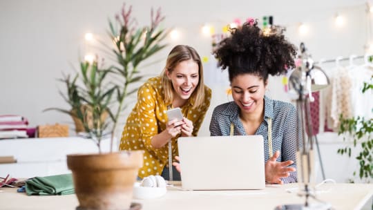 women looking at computer screen