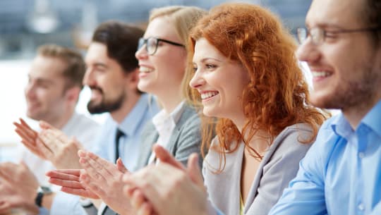 Coworkers clapping