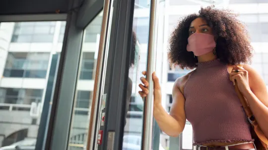 Woman walking into office