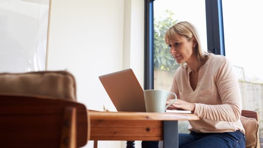 woman working on computer at home