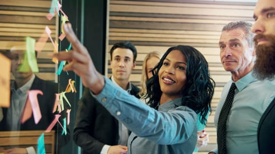 Woman working at whiteboard