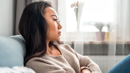 Sad woman on couch