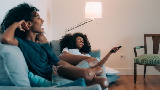 woman watching feminist movie on a tablet