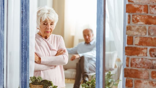 Sad woman looking out window