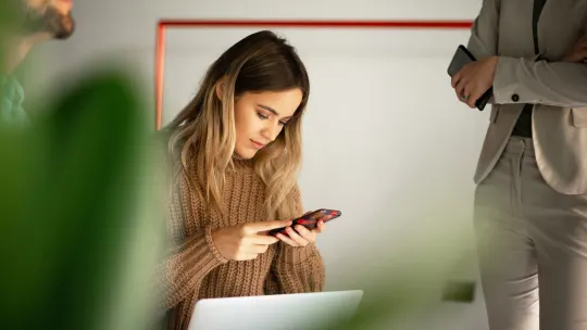 woman on her phone at work
