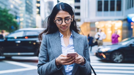 Woman walking on phone