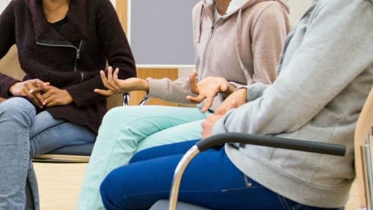group of women engaged in a heated discussion