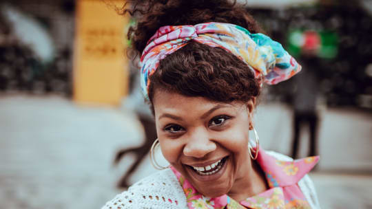 Happy woman with scarf in her hair