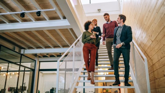 group of employees walking having a meeting