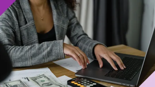 Entrepreneur at a computer, illustrating how to pay yourself as a business owner