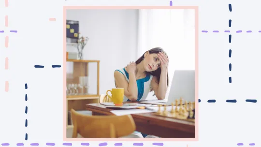 A woman looking frustrated sitting at a computer.