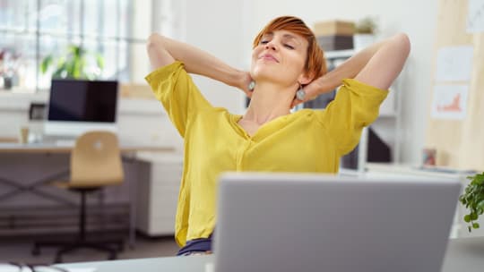 woman stretching at work