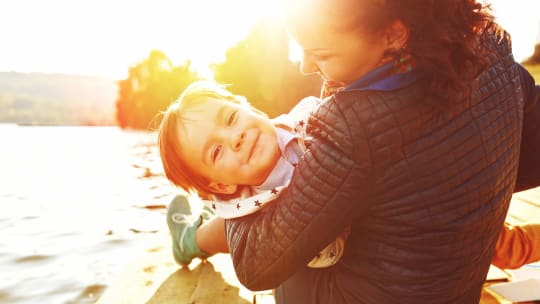 mother and child on a dock