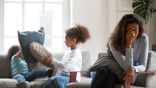 woman overwhelmed by kids