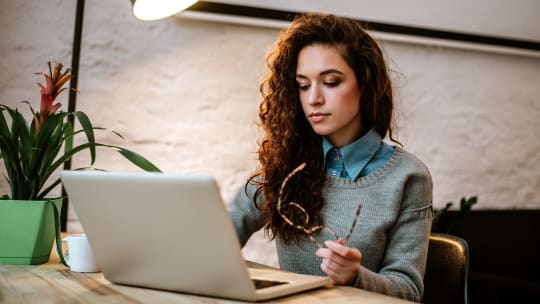 Woman on laptop searching for something