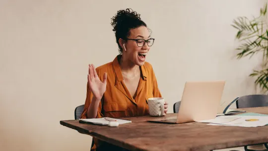 Happy woman on laptop