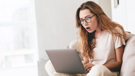 Shocked woman on the computer